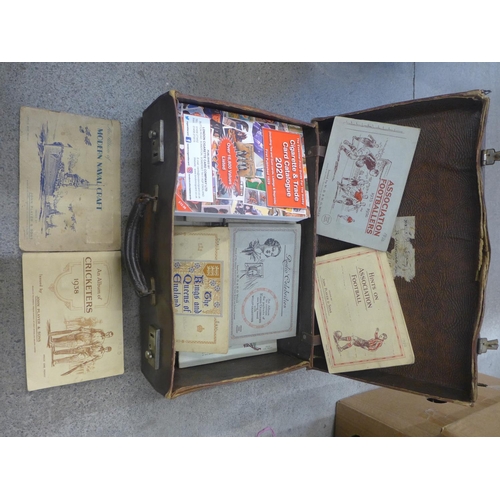 745 - A case of cigarette card albums