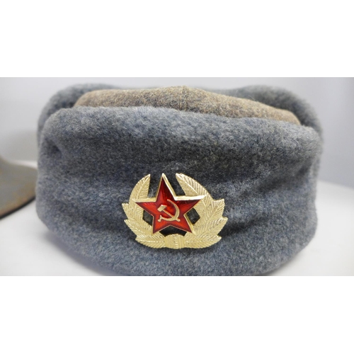 792 - A Civil Defence helmet and a Russian Ushanka