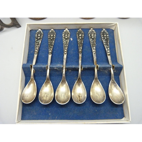 853 - A silver toast rack, a set of six .800 silver spoons, a pair of silver posy vases and one other silv... 