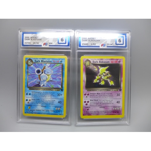 879 - Two Graded PG Graded Pokemon cards; 2000 Rocket Dark Blastoise and 2000 Rocket Dark Alakazam Holo