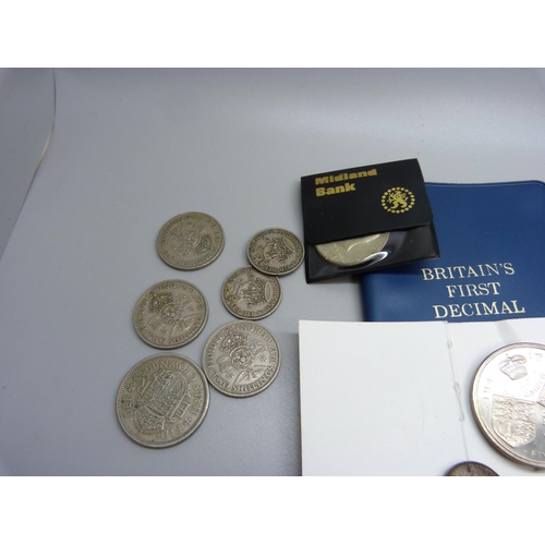 913 - A collection of commemorative coins, some half silver coins and three £5 coins