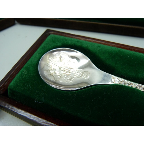 919 - Three Peter Jackson designed and one other Christmas silver spoons, 120g, cased