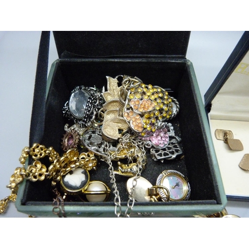 924 - Costume brooches and a pair of gold plated cufflinks