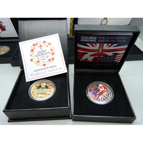 933 - A mixed collection of mint coins packs, including military themed (5)