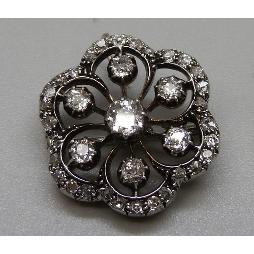 992 - A circa 1880-1890 diamond encrusted pendant set in yellow and white metal, 21mm