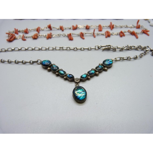 999 - A silver and guilloche enamel bracelet, a coral necklace, one other necklace, etc.