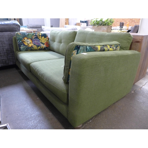 1392 - A forest green velvet 2.5 seater sofa with floral design scatter cushions