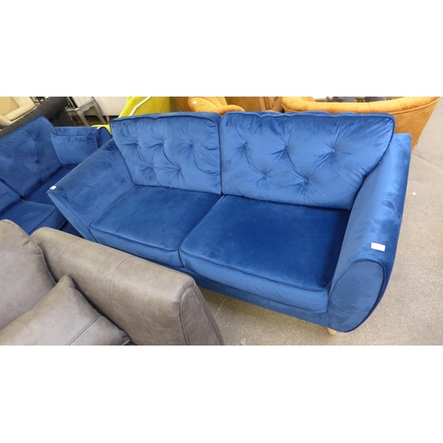 1554 - A pair of blue Hoxton velvet three seater sofas and a two seater sofa