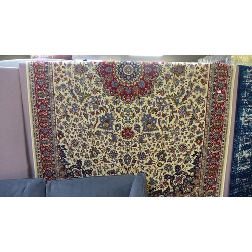 1577 - An ivory ground full pile Cashmere carpet, floral medallion design, 200cm x 300cm