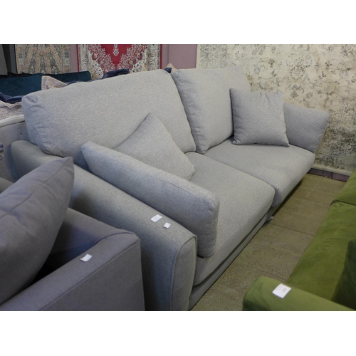 1598 - A stone grey upholstered 3.5 seater sofa - damaged feet