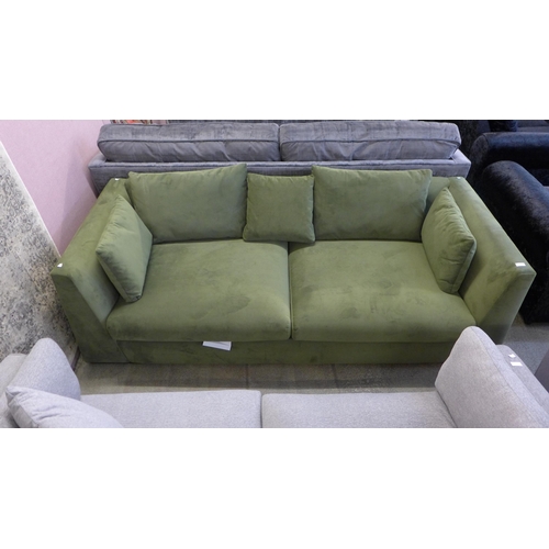 1601 - A Forest green velvet four seater sofa - odd cushions