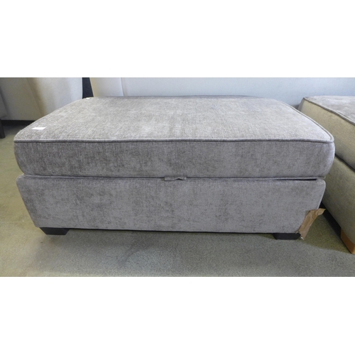 1605 - A grey fabric ottoman footstool - damaged