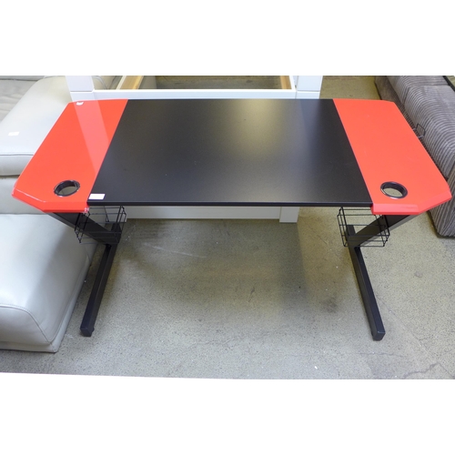 1631 - A Slade black and red gaming desk, slight damage