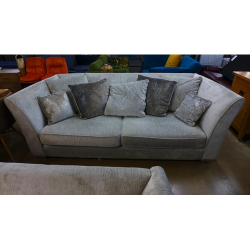 1301 - An Aria silver upholstered four seater sofa and love seat