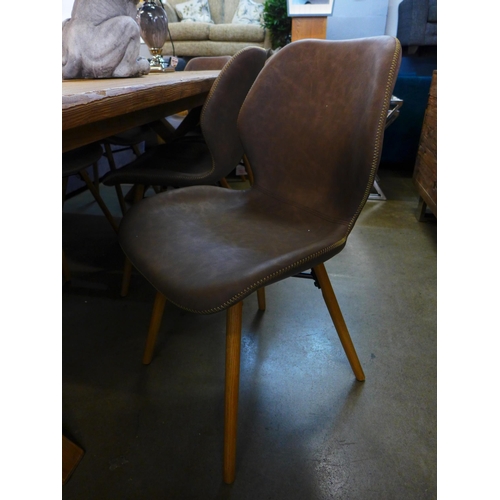 1342 - A 2m pine dining table with a set of 8 Dwanda brown leather effect chairs