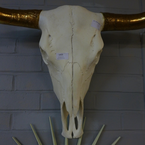 1435 - A large bison skull with gold horns