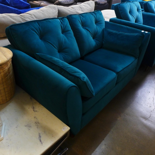 1449 - A teal velvet two seater sofa