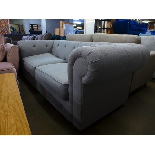 1474 - A grey Chesterfield upholstered three seater sofa