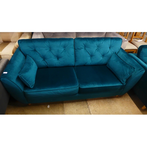 1486 - An emerald velvet three and two seater sofa