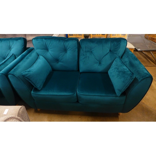 1486 - An emerald velvet three and two seater sofa