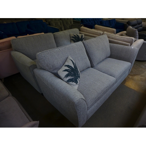 1492 - A pair of light grey upholstered four seater sofas