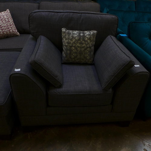 1500 - A shadow grey upholstered three seater sofa and armchair with footstool