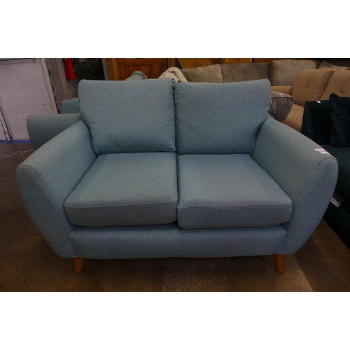 1553 - A baby blue upholstered two seater sofa with a pair of armchairs - slight marks