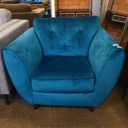 1556 - An aquamarine velvet armchair