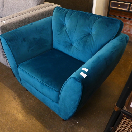 1556 - An aquamarine velvet armchair