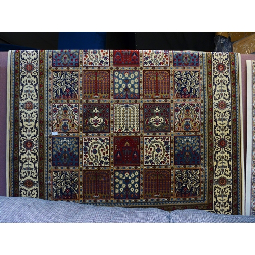 1575 - An ivory ground full pile Cashmere rug, Persian panel design, 240cm x 160cm