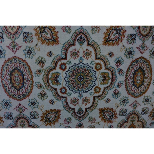 1576 - A cream ground all over floral patterned carpet, 200cm x 300cm