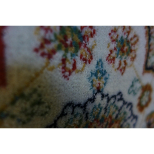 1576 - A cream ground all over floral patterned carpet, 200cm x 300cm