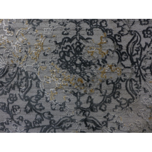 1599 - A gold and grey ground vintage style contemporary design rug, full pile, 230cm x 160cm