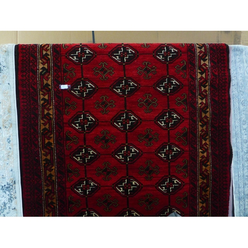 1600 - A rich red ground hand woven full pile Persian Nomadic rug, 203cm x 135cm