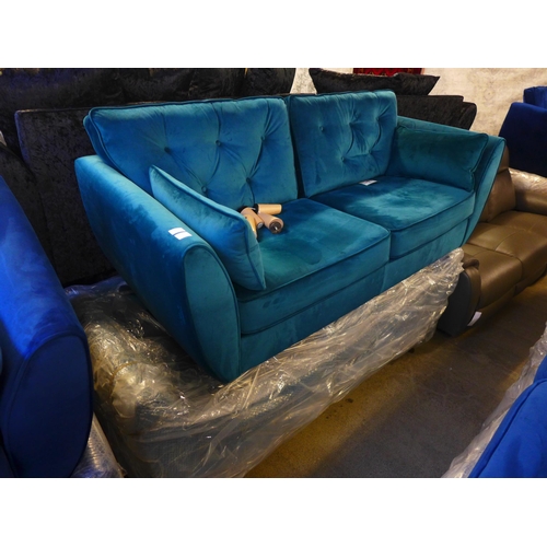 1617 - A pair of teal velvet three seater sofa