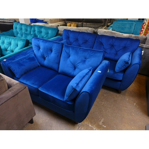 1496 - A deep ocean blue velvet three and two seater sofa