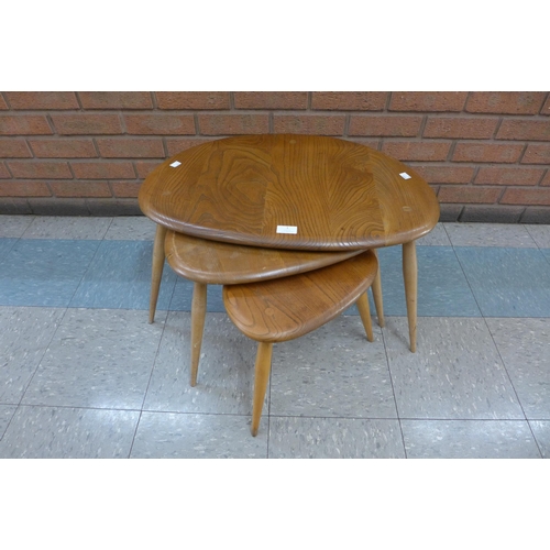 1 - An Ercol Blonde elm and beech pebble shaped nest of tables