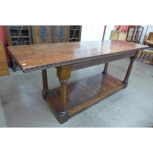 100 - A 17th Century style oak refectory table