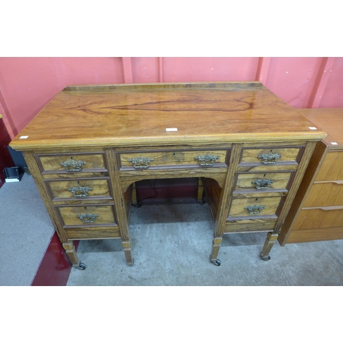 102 - A Victorian Maple & Co. figured walnut desk