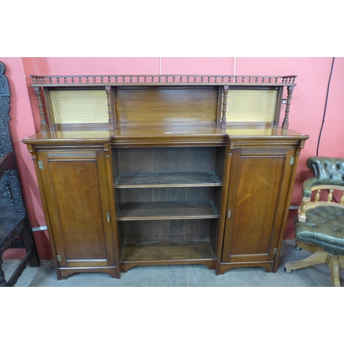 104 - A Victorian Aesthetic Movement walnut breakfront bookcase