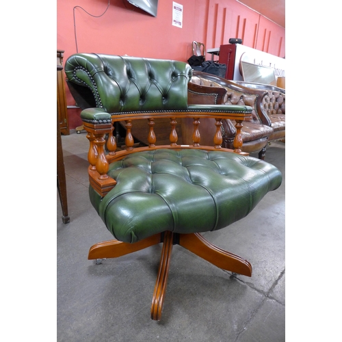 114 - A beech and green leather revolving Captains desk chair