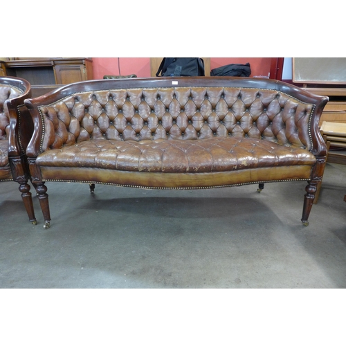 115 - A Regency style mahogany and brown buttoned leather settee and tub chair