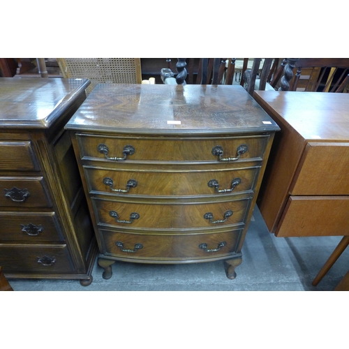 131 - A small walnut bow front chest of drawers