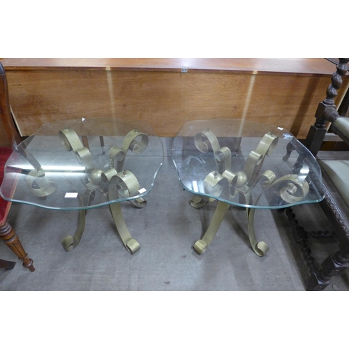 139 - A pair of Italian gilt metal and glass topped occasional tables