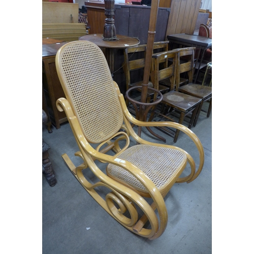 142 - A beech bentwood bergere rocking chair