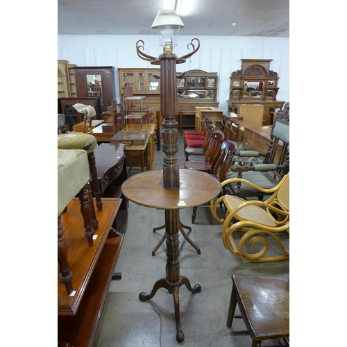 144 - A mahogany floor standing lamp