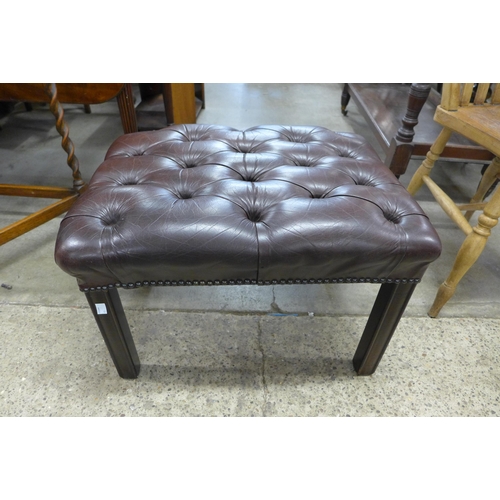 147 - A mahogany and brown buttoned leather footstool