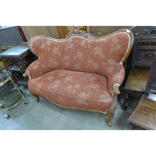 148 - An early 20th Century French carved beech and fabric upholstered settee