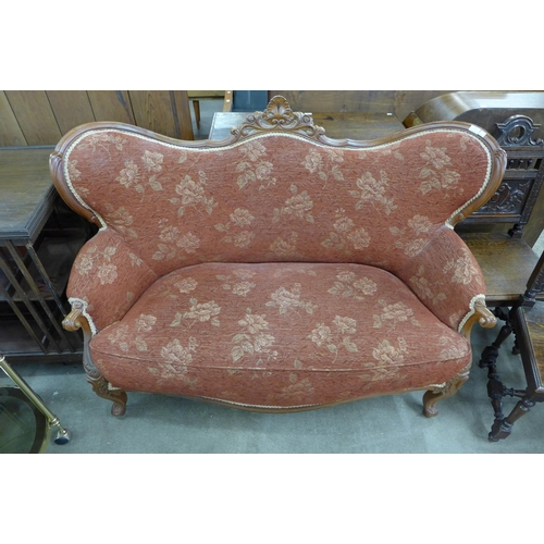 148 - An early 20th Century French carved beech and fabric upholstered settee