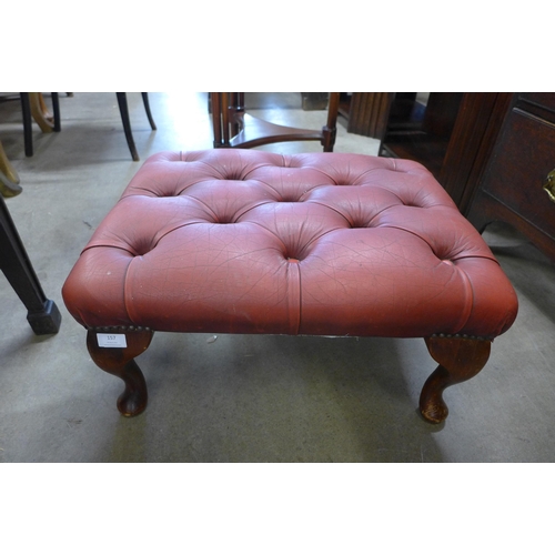 157 - An oxblood leather footstool